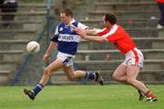 14 April 2002; Chris Conway of Laois in action against John Donaldson of Armagh during the Allianz National Football League Division 2 Semi-Final match between Armagh and Laois at Pearse Park in Longford. Photo by Ray McManus/Sportsfile
