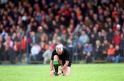 14 April 2002; Referee Gerry Kinneavy ties his laces during the Allianz National Football League Division 2 Semi-Final match between Armagh and Laois at Pearse Park in Longford. Photo by Ray McManus/Sportsfile