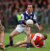 14 April 2002; Greg Ramsbottom of Laois gets away from Kieran McGeeney of Armagh during the Allianz National Football League Division 2 Semi-Final match between Armagh and Laois at Pearse Park in Longford. Photo by Ray McManus/Sportsfile