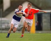 14 April 2002; Greg Ramsbottom of Laois in action against Paddy McKeever of Armagh during the Allianz National Football League Division 2 Semi-Final match between Armagh and Laois at Pearse Park in Longford. Photo by Ray McManus/Sportsfile