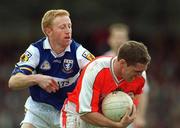 14 April 2002; Kieran McGeeney of Armagh in action against Michael Lawlor of Laois during the Allianz National Football League Division 2 Semi-Final match between Armagh and Laois at Pearse Park in Longford. Photo by Ray McManus/Sportsfile