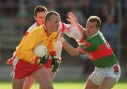 14 April 2002; Tyrone goalkeeper Peter Ward in action against Marty McNicholas of Mayo during the Allianz National Football League Division 1 Semi-Final match between Mayo and Tyrone at Brewster Park in Enniskillen, Fermanagh. Photo by Damien Eagers/Sportsfile