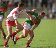 14 April 2002; Marty McNicholas of Mayo in action against Colin Holmes of Tyrone during the Allianz National Football League Division 1 Semi-Final match between Mayo and Tyrone at Brewster Park in Enniskillen, Fermanagh. Photo by Damien Eagers/Sportsfile