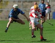14 April 2002; Kevin Ryan of Dublin in action against, Dominic Magill of Derry during the Allianz National Hurling League Division 1 Relegation Play-Off match between Dublin and Derry at Brewster Park in Enniskillen, Fermanagh. Photo by Damien Eagers/Sportsfile