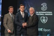 19 March 2017; Conor McCarthy Scoil Mhuire ages Smal, Blarney) is presented with the FAI School's International Player of the Year Award Gavin McAllister PR & Sponsorship Manager of Three Ireland (left) and by FAI President Tony Fitzgerald during the Three FAI International Soccer Awards at RTE Studios in Donnybrook, Dublin. Photo by Brendan Moran/Sportsfile