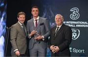 19 March 2017; Paul Rooney is presented with the FAI Colleges / Universities International Player of the Year by Gavin McAllister PR & Sponsorship Manager of Three Ireland, left, and FAI President Tony Fitzgerald during the Three FAI International Soccer Awards at RTE Studios in Donnybrook, Dublin. Photo by Brendan Moran/Sportsfile