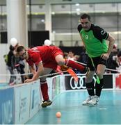 20 March 2017; Team Ireland's Lorcan Byrne, a member of Stewartscare Special Olympics Club, from Ballyfermot, Dublin in action against Kevin Boyer, Austria, during the Team Ireland 2 v Austria 2 Floorball Round Robin game at the 2017 Special Olympics World Winter Games in the Messe Graz Center, Graz, Austria. Photo by Ray McManus/Sportsfile