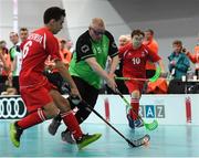 20 March 2017; Team Ireland's Patrick Tunstead, a member of Estuary Centre Special Olympics Club, from Julianstwon, Co. Meath, in action against Michael Moik, Austria, during the Team Ireland 2 v Austria 2 Floorball Round Robin game at the 2017 Special Olympics World Winter Games in the Messe Graz Center, Graz, Austria. Photo by Ray McManus/Sportsfile