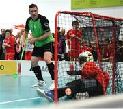 20 March 2017; Team Ireland's Lorcan Byrne, a member of Stewartscare Special Olympics Club, from Ballyfermot, Dublin, beats the Austrian goalkeeper Nathan Quiala to score his side's opening goal during the Team Ireland 2 v Austria 2 Floorball Round Robin game at the 2017 Special Olympics World Winter Games in the Messe Graz Center, Graz, Austria. Photo by Ray McManus/Sportsfile