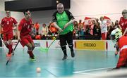 19 March 2017; Team Ireland's Patrick Tunstead, a member of Estuary Centre Special Olympics Club, from Julianstwon, Co. Meath, in action against Michael Moik, Austria, during the Team Ireland 2 v Austria 2 Floorball Round Robin game at the 2017 Special Olympics World Winter Games in the Messe Graz Center, Graz, Austria. Photo by Ray McManus/Sportsfile