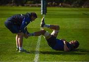 20 March 2017; Leinster's Mike McCarthy stretches with the help of Leinster senior rehabilitation coach Diarmuid Brennan during squad training at UCD in Dublin. Photo by Stephen McCarthy/Sportsfile