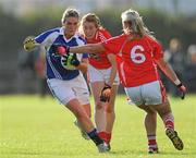 27 August 2011; Grainne Dunne, Laois, in action against Brid Stack, right, and Rena Buckley, Cork. TG4 All-Ireland Ladies Senior Football Championship Semi-Final, Cork v Laois, Leahy Park, Cashel, Co. Tipperary. Picture credit: Brian Lawless / SPORTSFILE