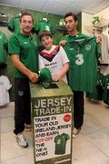 30 August 2011; Republic of Ireland players Liam Lawrence, left, and Stephen Kelly pictured with Cian Maxwell, age 11, from Maynooth, Co. Kildare, at a surprise Three Trade In visit to Champion, Jervis Street. Three is asking Irish fans to Go Green With Pride and trade in their old Republic of Ireland football jerseys in any Champion store nationwide and get €20 off the new home jersey. The traded in jerseys will be donated to Friends In Ireland, a charity founded by Marian Finucane. The scheme will run until September 30th. Champion Sports, Jervis Centre, Dublin. Picture credit: Brian Lawless / SPORTSFILE
