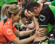 22 March 2017; Team Ireland's Lorcan Byrne, a member of Stewartscare Special Olympics Club, from Ballyfermot, Dublin, who scored a brilliant goal during the game, is comforted by Karen Coventry, Head of Delegation, and supporters after Team Ireland were beated 3 - 2 against Cote d'Ivoire during a quarter final in the Floorball Competition at the Floorball quarter final game Ireland '2' v Cote d'Ivoire at the 2017 Special Olympics World Winter Games in the Messe Graz Center, Graz, Austria. Photo by Ray McManus/Sportsfile