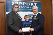 17 March 2017; Lúthchleas Gael Aogán Ó Fearghail presents Syl Coote and his grandchild Anton Coote from St Andrews, Carlow, who won a &quot;All Ireland Final Corporate package&quot; during the presentation of prizes to the winners of the GAA National Club Draw at Croke Park in Dublin. Uachtarán Chumann Lúthchleas Gael Aogán Ó Fearghail Photo by Ray McManus/Sportsfile