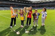30 August 2011; Camogie Association President Joan O’Flynn urged Camogie and Gaelic games fans to come and join in the celebration of Camogie’s 80th championship final by attending the All Ireland Finals in association with RTÉ Sport at Croke Park on Sunday September 11th. Pictured at the announcement of the birthday celebrations are, from left to right, Patrick Boylan, six years, from The Naul, Co. Dublin, Jenna Boylan, three years, from The Naul, Co. Dublin, Millie Boylan, six years, from The Naul, Co. Dublin, Padraig Gaughan, six years, from Ashbourne, Co. Meath, and Deirdre Gaughan, six years, from Ashbourne, Co. Meath. Launch of the All-Ireland Camogie Championship Finals, Croke Park, Dublin. Picture credit: Ray McManus / SPORTSFILE