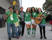 2 September 2011; Former Republic of Ireland star Jason McAteer, who scored the famous winning goal against Holland to secure a place at the 2002 World Cup ten years ago this week, with models Georgia Salpa and Daniella Moyles and fans Alan and Elizabeth Monaghan and Clara Rose, from Kilcloon, Co. Meath, at the Aviva Stadium where they were giving out free jerseys to fans as part of Three’s ‘Go Green with Pride’ campaign that is giving Irish fans the chance to trade in their old Republic of Ireland football jerseys in any Champion Sports store nationwide and get €20 off the brand new Republic of Ireland home jersey. The traded in jerseys will be collected and donated to Friends In Ireland, a charity founded by Marian Finucane that cares for orphans and vulnerable children affected by HIV/AIDS in South Africa. Aviva Stadium, Lansdowne Road, Dublin. Photo by Sportsfile
