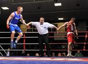 2 September 2011; Ray Moylette, left, St. Annes, European Elite Champion, celebrates as referee Michael Gallagher raises his arm as he is declared the winner of the 64kg Senior Irish Elite Box-Off bout against Ross Hickey, Grangecon. Irish Amateur Box-Off, National Stadium, Dublin. Picture credit: Barry Cregg / SPORTSFILE