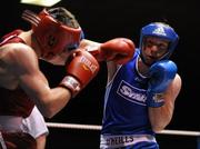2 September 2011; Ray Moylette, right, St. Annes, European Elite Champion, exchanges punches with Ross Hickey, Grangecon, Irish Elite Champion, during their 64kg Irish Senior Elite Box-Off bout. Irish Amateur Box-Off, National Stadium, Dublin. Picture credit: Barry Cregg / SPORTSFILE