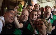 24 March 2017; Coach Mark McInerney, left, and Head of Delegation karentry Coventry, right, 'photobomb' as Team Ireland's Thomas Caulfield, a member of Stewartscare Special Olympics Club, from Ballyfermot, Dublin, takes a selfie with his Ireland T2 team mates, Matthew Colgan, a member of Estuary Centre Special Olympics Club, from Swords, Co. Dublin, Lorcan Byrne, a member of Stewartscare Special Olympics Club, from Ballyfermot, Dublin, Raymond McClearn, a member of Loughrea Training Centre Special Olympics Club, from Loughrea, Co. Galway, Patrick Tunstead, a member of Estuary Centre Special Olympics Club, from Julianstwon, Co. Meath, and Lee Ryan Byrne, a member of Sports Club 15 Special Olympics Club, from Donaghmede, Dublin, following the presentations for the Floorball competitions at the 2017 Special Olympics World Winter Games in the Messe Graz Center, Graz, Austria. Photo by Ray McManus/Sportsfile