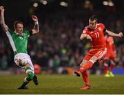 24 March 2017; Gareth Bale of Wales has a shot at goal blocked by Glenn Whelan of Republic of Ireland during the FIFA World Cup Qualifier Group D match between Republic of Ireland and Wales at the Aviva Stadium in Dublin. Photo by Ramsey Cardy/Sportsfile