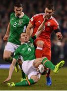 24 March 2017; Sam Vokes of Wales is tackled by John O'Shea of Republic of Ireland during the FIFA World Cup Qualifier Group D match between Republic of Ireland and Wales at the Aviva Stadium in Dublin. Photo by Ramsey Cardy/Sportsfile