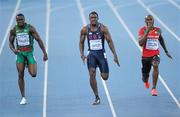 28 August 2011; Athletes, from left, Ngonidzashe Makusha, Zimbabwe, Justin Gatlin, USA, and Kim Collins, St. Kitts & Nevins, in action during their Semi-Final of the Men's 100m event. IAAF World Championships - Day 2, Daegu Stadium, Daegu, Korea. Picture credit: Stephen McCarthy / SPORTSFILE