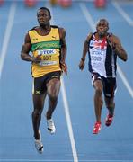 28 August 2011; Usain Bolt, Jamaica, and Marlon Devonish, Great Britain, in action during their Semi-Final of the Men's 100m event. IAAF World Championships - Day 2, Daegu Stadium, Daegu, Korea. Picture credit: Stephen McCarthy / SPORTSFILE