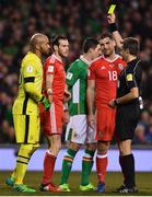 24 March 2017; Gareth Bale of Wales is shown a yellow card by referee Nicola Rizzoli during the FIFA World Cup Qualifier Group D match between Republic of Ireland and Wales at the Aviva Stadium in Dublin. Photo by Ramsey Cardy/Sportsfile
