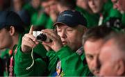 24 March 2017; Team Ireland's Matthew Colgan, a member of Estuary Centre Special Olympics Club, from Swords, Co. Dublin, takes a photograph at the 2017 Special Olympics World Winter Games Closing Ceremony in Stadium Graz, Graz, Austria. Photo by Ray McManus/Sportsfile