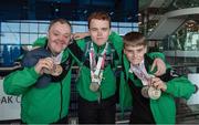 25 March 2017; Team Ireland's Cyril Walker, a member of Skiability Special Olympics Club, from Markethill, Co. Armagh, left, Sean McCartan, a member of Skiability Special Olympics Club, from Carryduff, Co. Antrim, and Caolan McConville, right, a member of Skiability Special Olympics Club, from Aghagallon, Co. Armagh, as the Team Ireland athletes and coaches returned from the 2017 Special Olympics World Winter Games in Graz, Austria, at Dublin Airport in Dublin. Photo by Ray McManus/Sportsfile