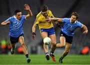 25 March 2017; Ultan Harney of Roscommon in action against Niall Scully, left, and Michael Fitzsimons of Dublin during the Allianz Football League Division 1 Round 6 game between Dublin and Roscommon at Croke Park in Dublin. Photo by Brendan Moran/Sportsfile