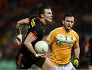 25 March 2017; Brendan Donaghy of Armagh in action against Patrick Gallagher of Antrim during the Allianz Football League Division 3 Round 6 game between Armagh and Antrim at Athletic Grounds in Armagh. Photo by Oliver McVeigh/Sportsfile