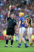4 September 2011; Tipperary's David Young is shown a yellow card by referee Brian Gavin. GAA Hurling All-Ireland Senior Championship Final, Kilkenny v Tipperary, Croke Park, Dublin. Picture credit: Pat Murphy / SPORTSFILE