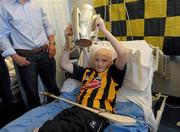 5 September 2011; 13 year old Colin Holden, from Ballyhale, Co. Kilkenny, holds the Liam MacCarthy cup aloft during the visit of the Kilkenny hurling team to Our Lady's Hospital for Sick Children, Crumlin, Dublin. Photo by Sportsfile