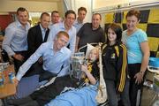 5 September 2011; 13 year old Colin Holden, from Ballyhale, Co. Kilkenny, with his sister Sarah, parents Joan and Chris, with Kilkenny players, from left, Jackie Tyrrell, Tommy Walsh, Eddie Brennan, Henry Shefflin and Michael Fennelly at Our Lady's Hospital for Sick Children, Crumlin, Dublin. Photo by Sportsfile