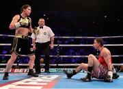 25 March 2017; Katie Taylor, left, has her opponent Milena Koleva on the canvas during their Manchester Fight Night super featherweight bout at Manchester Arena in Manchester, England. Photo by Lawrence Lustig/Sportsfile