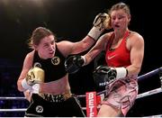 25 March 2017; Katie Taylor, left, lands a left jab on Milena Koleva during their Manchester Fight Night super featherweight bout at Manchester Arena in Manchester, England. Photo by Lawrence Lustig/Sportsfile