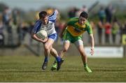 26 March 2017; Karl O'Connell of Monaghan in action against Eóin McHugh of Donegal during the Allianz Football League Division 1 Round 6 match between Donegal and Monaghan at Fr. Tierney Park in Ballyshannon, Co. Donegal. Photo by Philip Fitzpatrick/Sportsfile