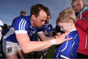 26 March 2017; Sean Johnston of Cavan signs the jersey of young Cavan supporter Dylan Bough, age 7, following the Allianz Football League Division 1 Round 6 match between Cavan and Kerry at Kingspan Breffni Park in Cavan. Photo by Stephen McCarthy/Sportsfile