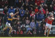 26 March 2017; Patrick Horgan of Cork scoring the winning point despite the efforts of Michael Cahill of Tipperary during the Allianz Hurling League Division 1A Round 5 match between Cork and Tipperary at Páirc Uí Rinn in Cork. Photo by Eóin Noonan/Sportsfile