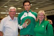 18 July 2011; Ireland's Brian Gregan, who won Silver in the U-23 400m race during the European Under 23 Championships in Ostrava shows off his silver medal with his coach John Shields, left, and Ireland team manager Theresa McDaid on his arrival back at Dublin Airport. Picture credit: Barry Cregg / SPORTSFILE