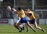 26 March 2017; Fergal Conway of Kildare in action against Gordon Kelly, left, and Eóin Cleary of Clare during the Allianz Football League Division 2 Round 6 match between Kildare and Clare at St Conleth's Park in Newbridge. Photo by Daire Brennan/Sportsfile