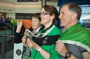25 March 2017; Team Ireland's Lorraine Whelan, a member of Kilternan Karvers Special Olympics Club, from Delgany, Co. Wicklow, with her mum Marie and dad Brendan, as the Team Ireland returned from the 2017 Special Olympics World Winter Games in Graz, Austria, at Dublin Airport in Dublin. Photo by Ray McManus/Sportsfile