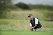 9 September 2011; Former Kilkenny hurler Eddie Keher, from Rower Inistioge GAA Club, Co. Kilkenny, pitches onto the 8th green during the 12th Annual All-Ireland GAA Golf Challenge 2011 Finals. Waterford Castle Golf and Country Club, Co. Waterford. Picture credit: Matt Browne / SPORTSFILE