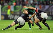 11 September 2011; Tom Court, Ireland, is tackled by Shawn Pittmann, left, and Phil Thiel, USA. 2011 Rugby World Cup, Pool C, Ireland v USA, Stadium Taranaki, New Plymouth, New Zealand. Picture credit: Brendan Moran / SPORTSFILE