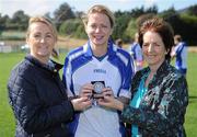 10 September 2011; Suzanne Holmes, Communications Director with MBNA, left, and Frances Stephenson from Bray Emmets GAA Club, Co. Wicklow, present Grainne Nulty, from Meath, with her third place medel after the 2011 MBNA Kick Fada ladies competition. Bray Emmets GAA Club, Co. Wicklow. Picture credit: Matt Browne / SPORTSFILE