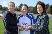 10 September 2011; Suzanne Holmes, Communications Director with MBNA, left, and Frances Stephenson from Bray Emmets GAA Club, Co. Wicklow, present Kim Flood from Dublin, with her second place medel after the 2011 MBNA Kick Fada ladies competition. Bray Emmets GAA Club, Co. Wicklow. Picture credit: Matt Browne / SPORTSFILE