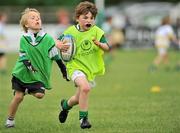 11 September 2011; Paul O'Dwyer, right, age 7, heads for the try line as Jack Dennis, left, age 6, closes him down, both from Naas, Co. Kildare, during the Leinster Rugby Club Open Day. Naas RFC, Co. Kildare. Picture credit: Barry Cregg / SPORTSFILE