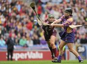 11 September 2011; Ursula Jacob, Wexford, shoots to score her side's second goal despite the attentions of Heather Cooney, Galway. All-Ireland Senior Camogie Championship Final in association with RTE Sport, Galway v Wexford, Croke Park, Dublin. Picture credit: Brian Lawless / SPORTSFILE